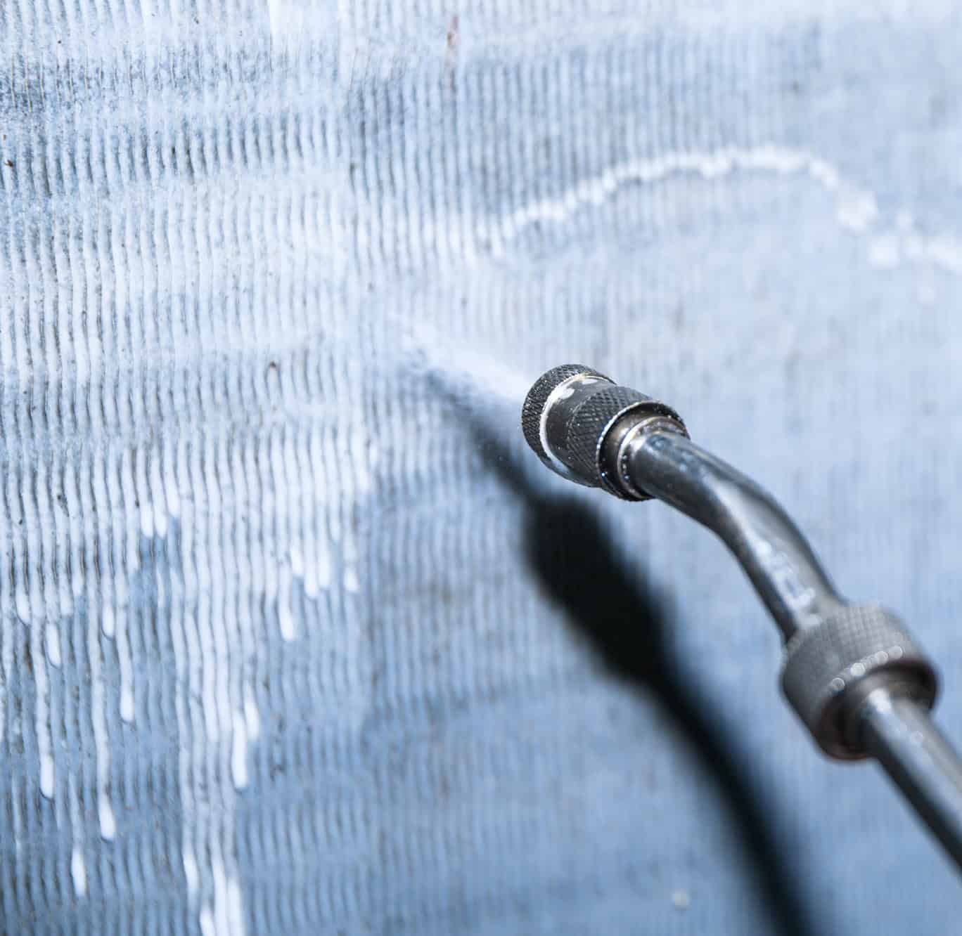 High-pressure water jet cleaning for industrial surfaces and equipment.