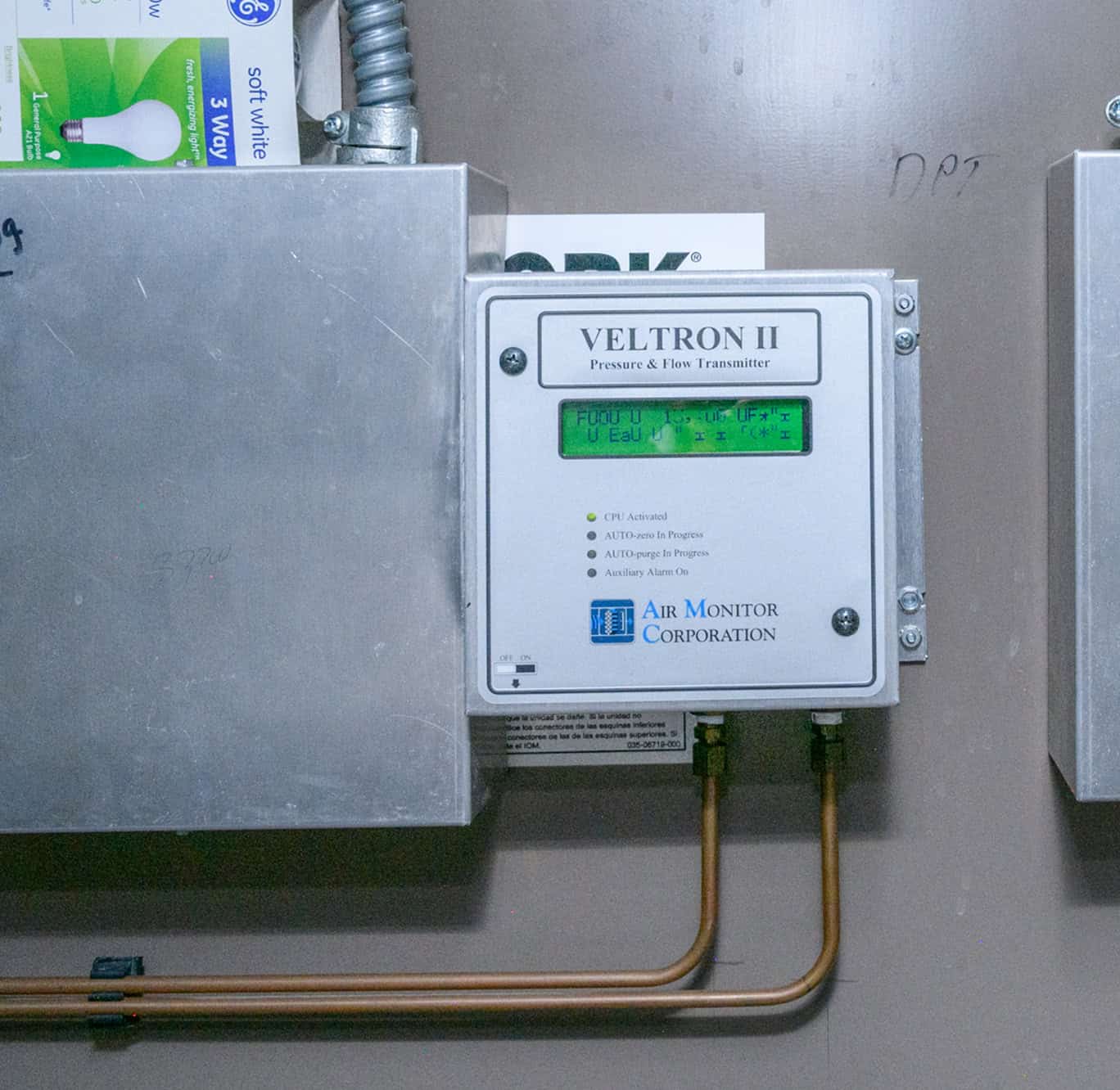 Veltron II pressure and flow transmitter installed in an industrial electrical panel for HVAC system.